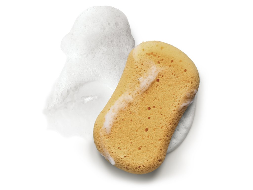 Sponsvorm met een gele kleur en een witte schuimrand eromheen. Sponsvorm met een gele kleur en een witte schuimrand eromheen.
