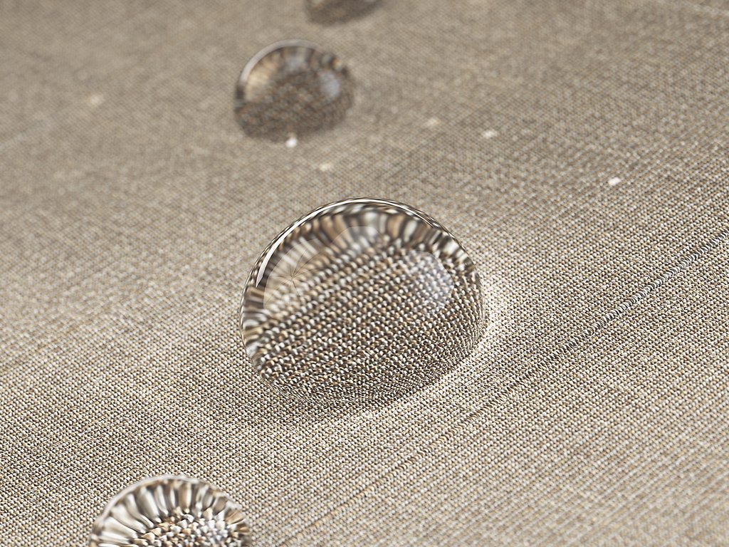 Close-up van waterdruppels op een stoffige, lichte ondergrond met een textuur. Close-up van waterdruppels op een stoffige, lichte ondergrond met een textuur.